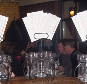 Beer glasses in caddies with menus, awaiting sampling at Bier Markt