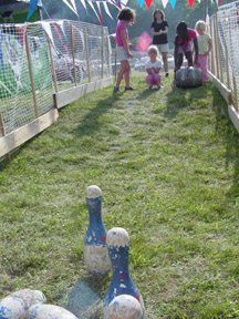 Kid's keg bowling at Harpoon NE BBQ Championships - kids enjoyed balloon art, face painting, coloring, and root beer