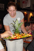 Laura Zimmer passes the papayas at Rogue's Public House on Flanders Pub, photo by Lucy Saunders